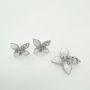 Silver-colored butterfly jewelry set with white enamel and sparkling zircon accents