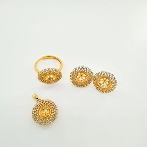 Detail of 18K gold-plated jewelry set with sunflower-shaped white crystal inlay