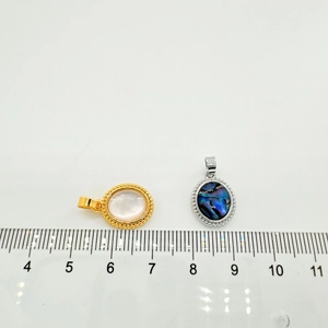 Detailed close-up of oval abalone shell pendants with rope-textured 18K gold-plated borders
