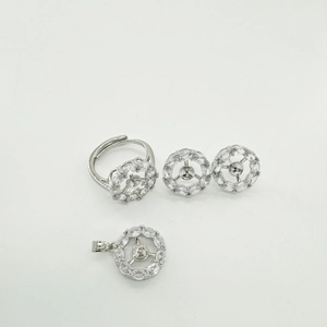 Detailed set of 18K silver-plated jewelry featuring hollow round cubic zirconia charms