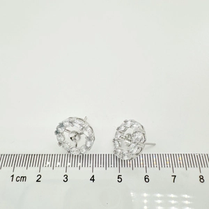 Macro detail of silver geometric earring base with zircon halo and 1.3cm scale measurement