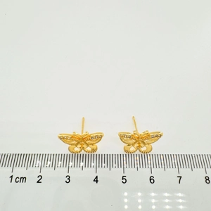 Close-up of 18K gold-plated butterfly studs with zircons and ruler for scale 1.5cm