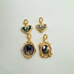 Set of four vintage 18K gold enamel pendants featuring natural pearls and oil painting style