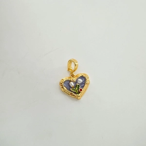 Detail of heart-shaped 18K enamel pendant with lily of the valley and pearl inlay