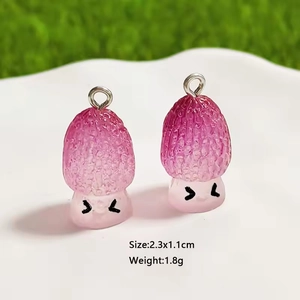 Detailed view of 2.3x1.1cm resin mushroom charms with pink gradient and cute faces