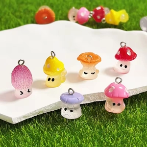 Colorful luminous resin mushroom charms with cute faces on a white cloud tray