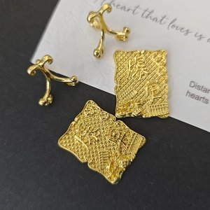 Macro shot of gold alloy desktop ornaments with wealth-themed calligraphy relief