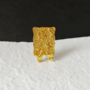 Golden prosperity desk ornament with Chinese characters and abacus relief on stand