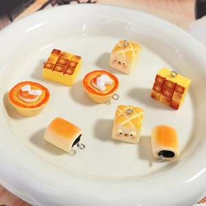 Detailed view of DIY resin miniature toast and egg tart charms with metal rings for jewelry