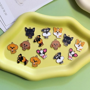 Detailed macro view of assorted colorful enamel dog charms for DIY jewelry making and crafts