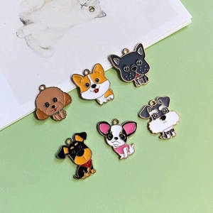 Flat lay of six cute cartoon alloy dog pendants with colorful enamel finishes for DIY crafts