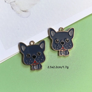 Detailed view of two blue enamel bulldog charms with gold trim and size measurements