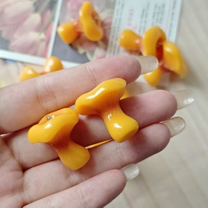 Realistic orange resin mushroom pendant with glossy finish and metal ring for DIY jewelry