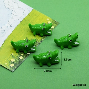Lichtgevende groene krokodillenhangers van hars voor het maken van doe-het-zelf sieraden