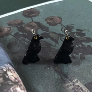 Gothic black resin crow charms with yellow eye detail and silver metal loops for DIY jewelry