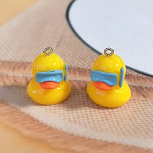 Cute yellow resin swimming duck charms with goggles for DIY earrings and keychains
