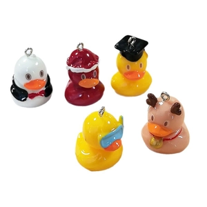 Set of cute resin cartoon duck charms with Christmas, graduation, and penguin themes