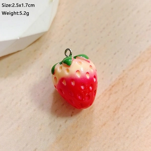 Detailed view of 2.5x1.7cm resin strawberry pendant charm with silver metal hook