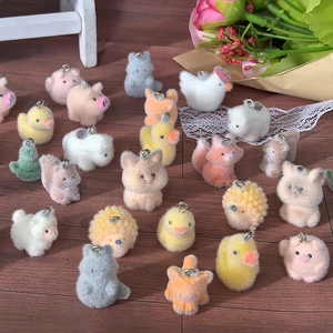 Close-up of colorful flocked animal charms for DIY jewelry and keychains