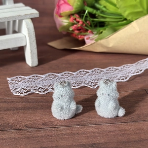 Detail of grey flocked kitten charms with metal rings for DIY jewelry accessories