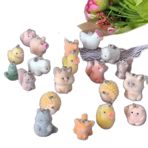 Flocked resin animal charms including pigs, cats, and squirrels for DIY jewelry making