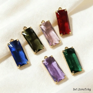 Set of six faceted crystal glass pendants with gold metal edging in varied colors