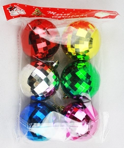 Detail of 6-piece colorful disco mirror balls in transparent festive packaging