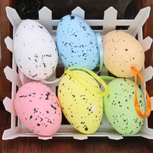 Close-up of colorful speckled Easter egg hanging decorations in a white basket