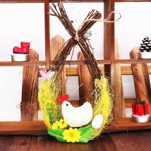 Detail of Easter egg wreath featuring woven twigs, yellow grass, and white eggs