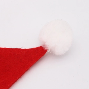 Classic red felt Christmas hat with fluffy white plush pompom on a clean white background