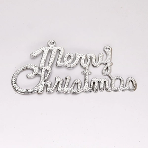 Close-up of silver Merry Christmas hanging sign with glitter texture and hanging holes