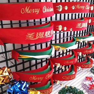 Red and green Merry Christmas banner with gold bells and festive lettering decoration