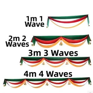 Detailed view of Christmas wave bunting in red, green, and gold with small bells