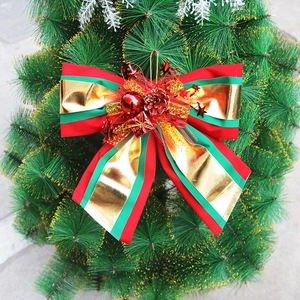 Detailed Christmas tree bow with red berries, pine cones and stars in festive colors