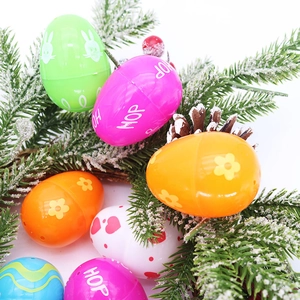 Detail of colorful plastic Easter eggs with bunny patterns on decorative pine branches
