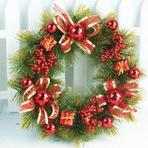 Detailed close-up of a 40cm Christmas wreath with red ornaments and golden pine needles