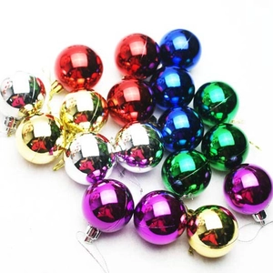 Assorted glossy electroplated Christmas tree ornaments in vibrant metallic colors