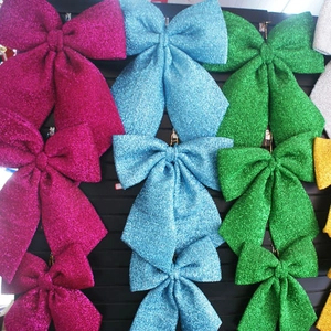 Close-up of sparkling colorful glitter bows for Christmas tree decoration and festive gifts