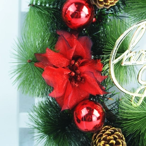 30cm Christmas wreath with pine needles, red flowers, pine cones and Merry Christmas sign