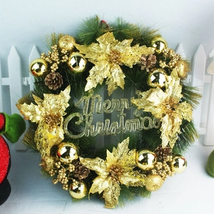 Close-up of a 40cm Christmas wreath with gold balls, pine cones, and Merry Christmas sign