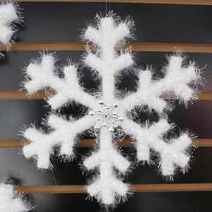 White foam snowflake decoration with silver sequin center for wedding and stage events
