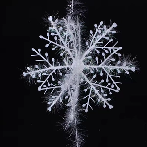 Macro detail of white plastic Christmas snowflake with holographic laser tinsel finish
