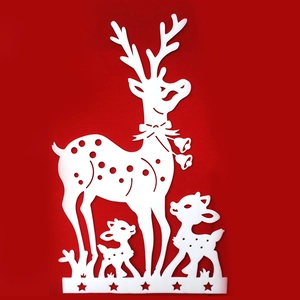 Detailed view of white cutout reindeer family ornament with stars for Christmas window display