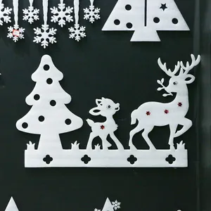 Detail of white foam reindeer and tree hanging ornaments with red sequin accents