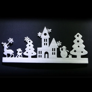Detailed view of white foam Christmas window silhouette with reindeer and trees