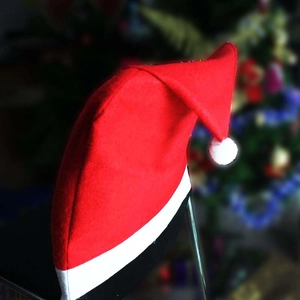 Classic red Santa hat chair covers made of soft non-woven fabric for Christmas decor