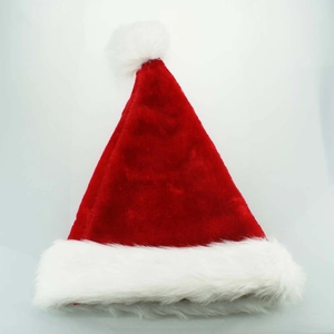 Classic red plush Christmas hat with thick white faux fur trim and pompom on white background