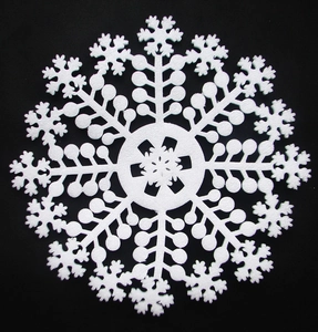 Detailed view of 70cm white foam snowflake ornament with intricate cutout patterns