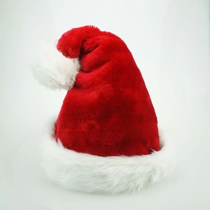Close-up of premium thick red plush Santa hat with soft white faux fur trim and pompom