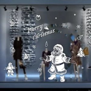 Gedetailleerde witte kerst raamstickers met de Kerstman, sneeuwvlokken en tekstontwerpen